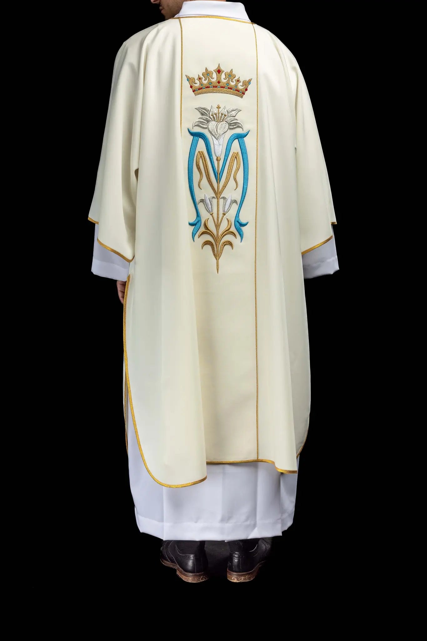 Ecru dalmatic with Marian embroidery, gold trim, and a matching stole.