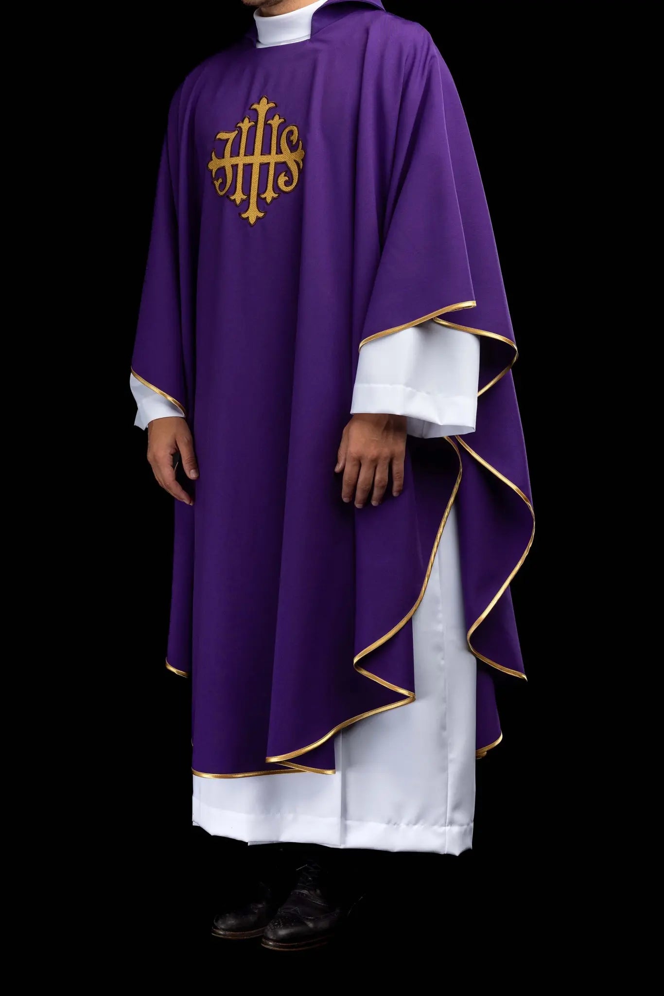 Purple chasuble with embroidered IHS symbol and gold trim, featuring a V-neckline and a matching stole.