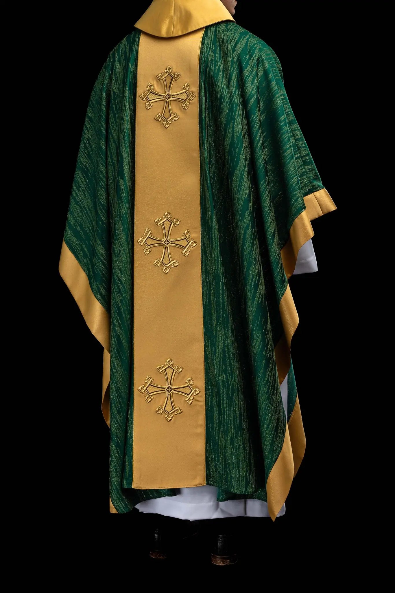 Green chasuble with a vertical gold band featuring embroidered crosses, gold trim on edges and collar, and a stand-up collar.