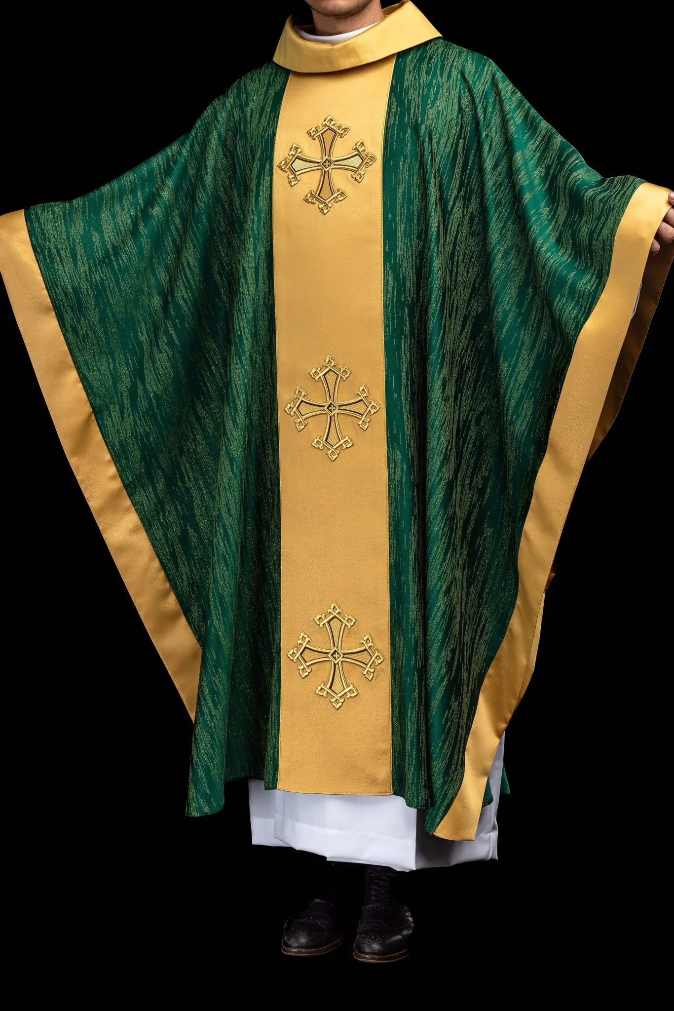 Green chasuble with a vertical gold band featuring embroidered crosses, gold trim on edges and collar, and a stand-up collar.