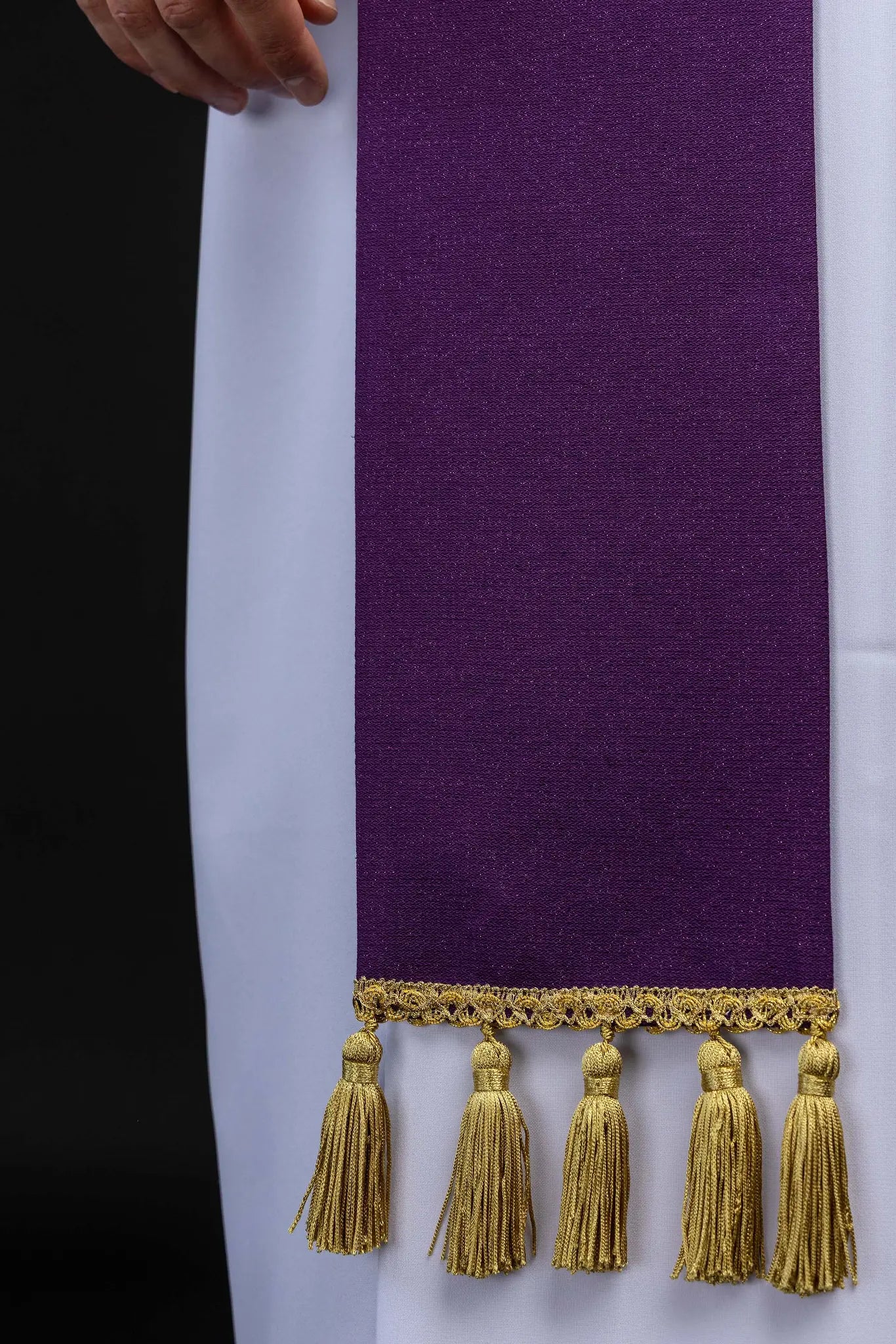 Purple Advent stole with gold IHS embroidery and Advent candle motif, made from shimmering fabric.