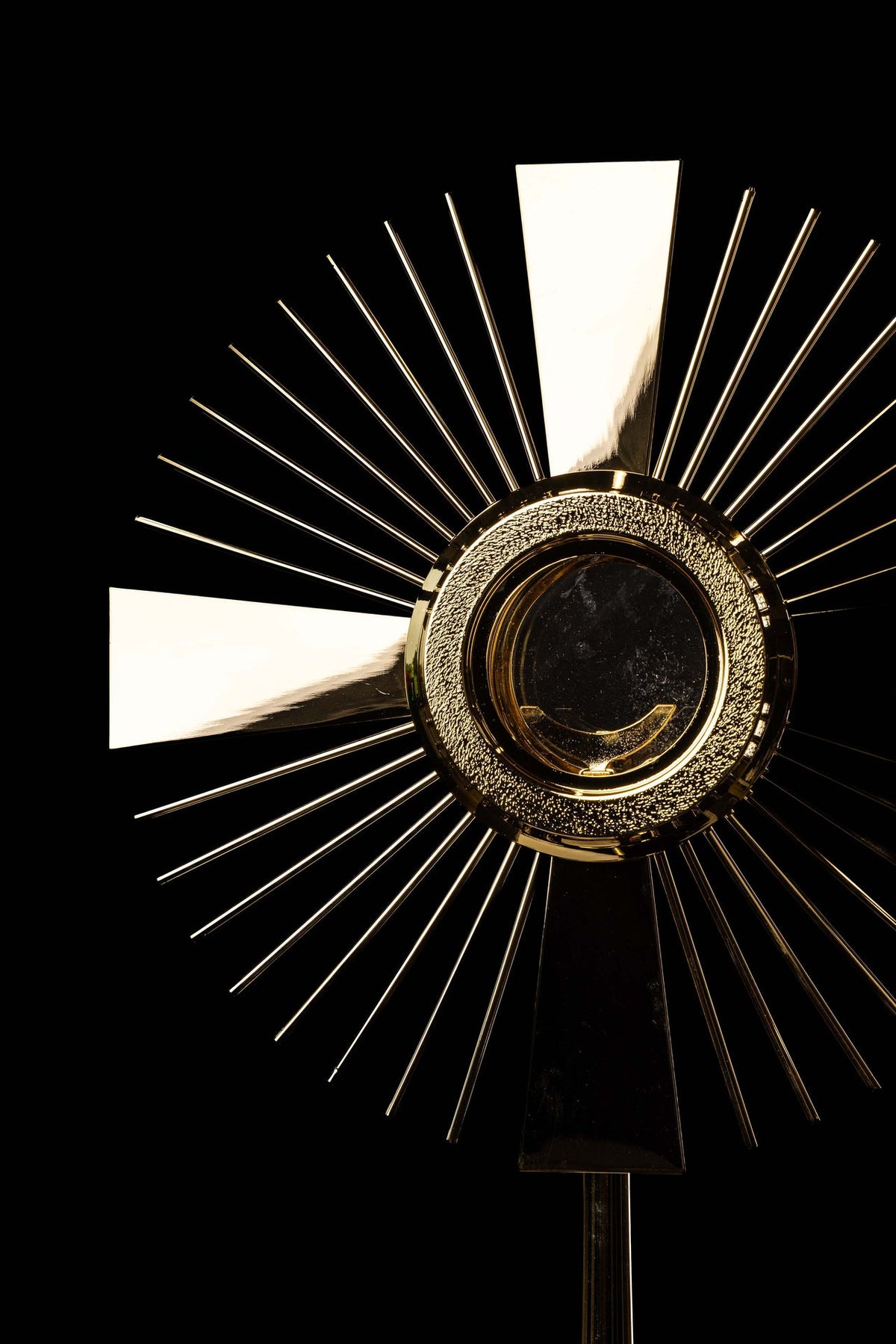 Gold-plated brass monstrance with cross and rays, upper close-up