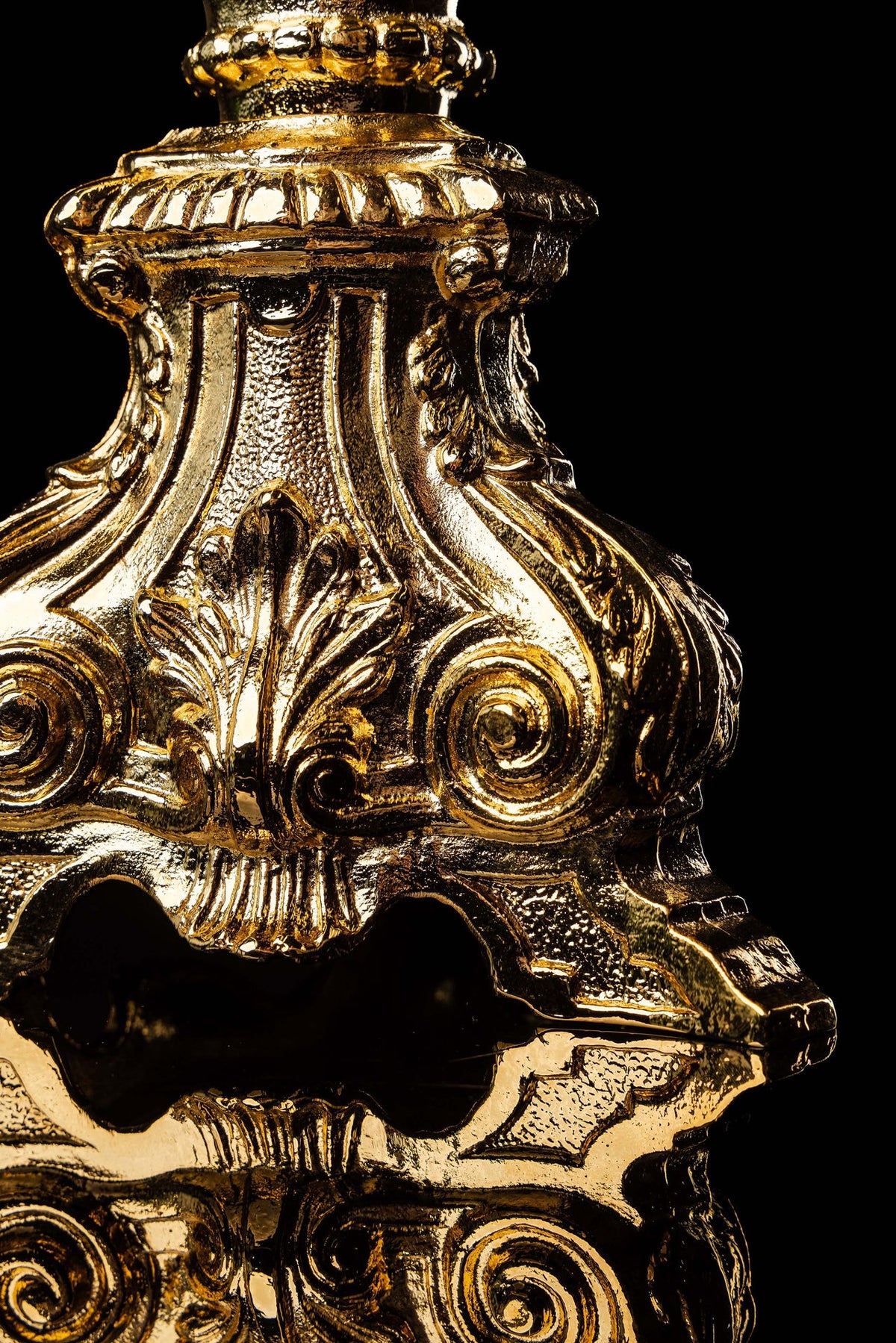 Gold-plated brass monstrance with radiant rays of Christ's Glory, filigree base close-up