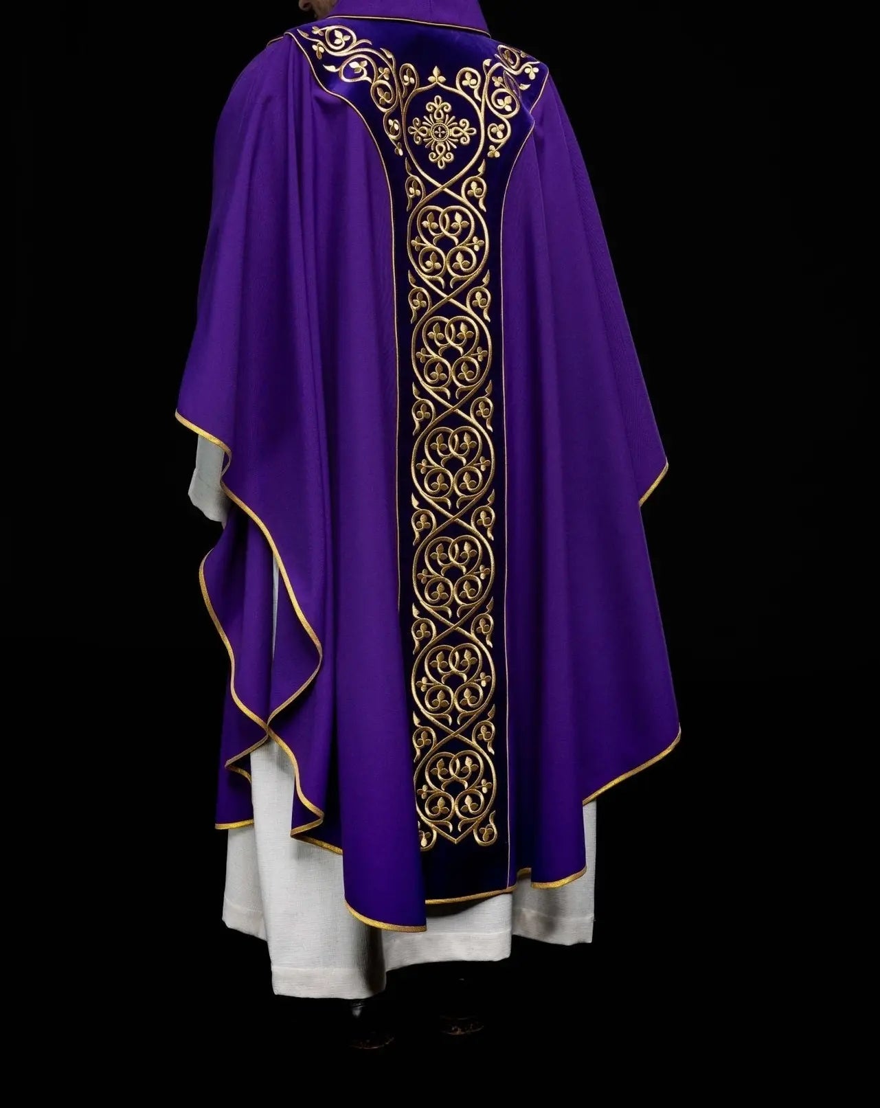 Purple liturgical chasuble decorated with embroidery on velvet