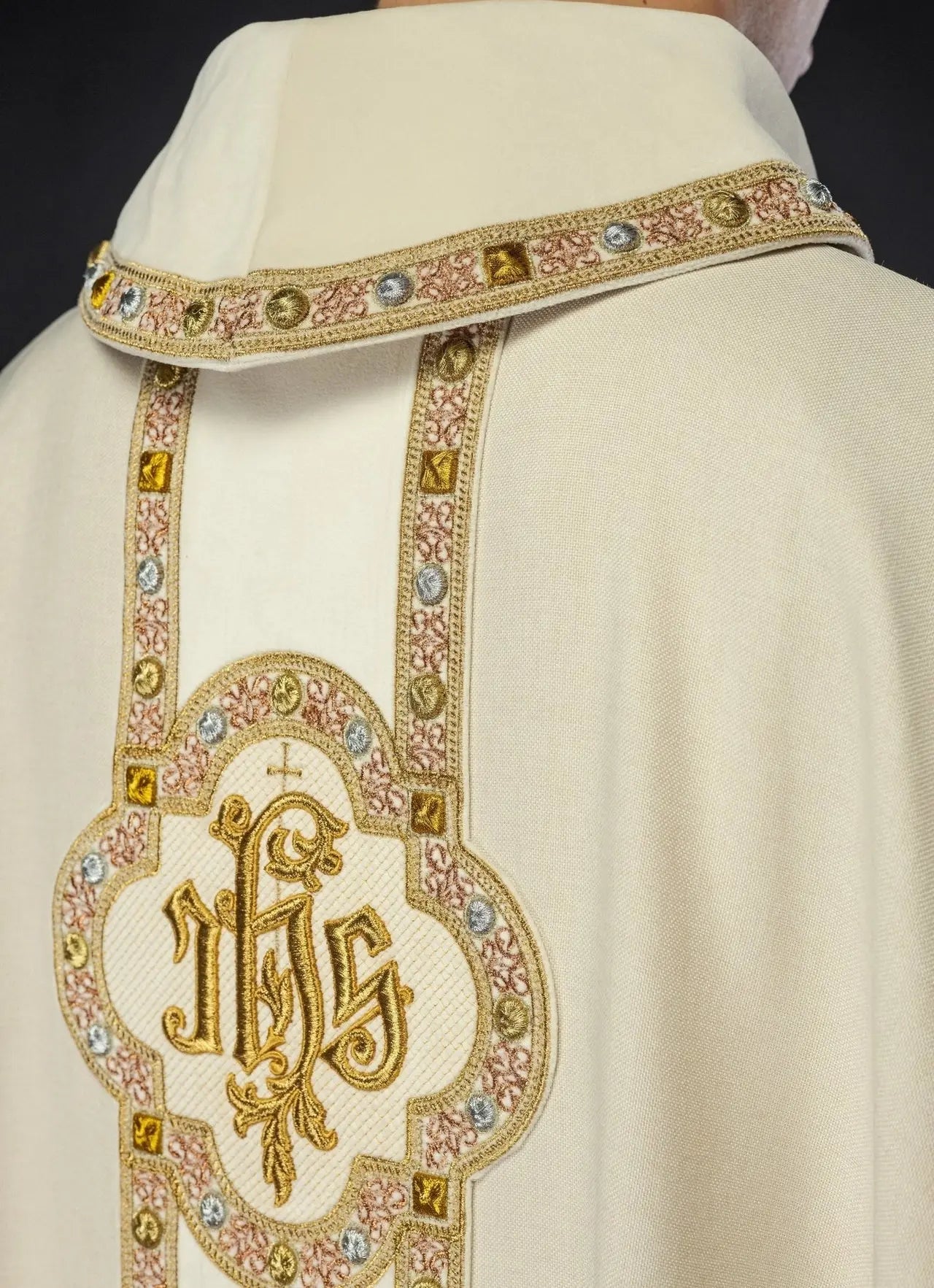 Chasuble with richly embroidered belt and piping around IHS embroidery and collar in ecru color